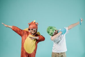 Two Boys in Dinosaur Costumes